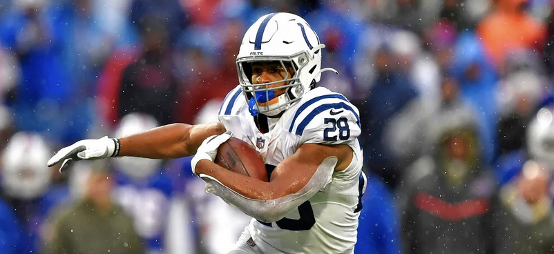 Jonathan Taylor of the Indianapolis Colts holding football