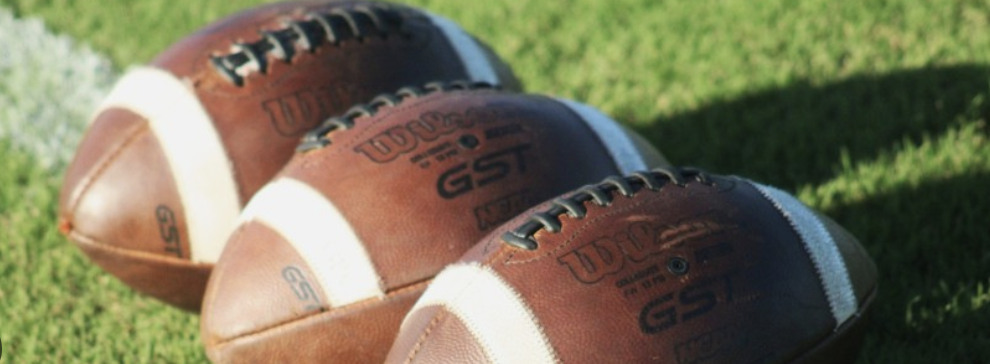three footballs 