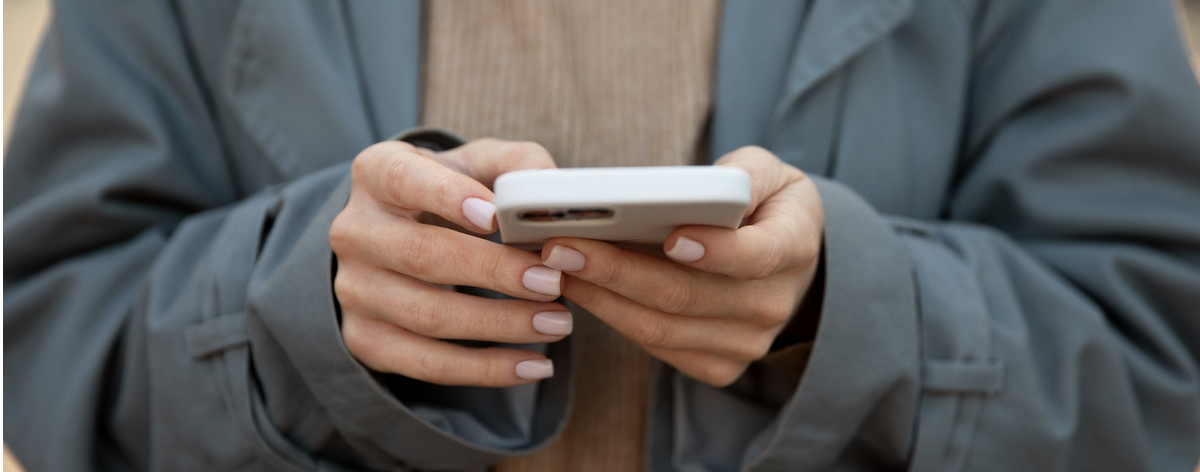Person scrolling on their phone