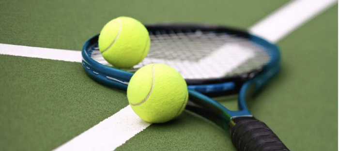 Tennis racquet and two balls