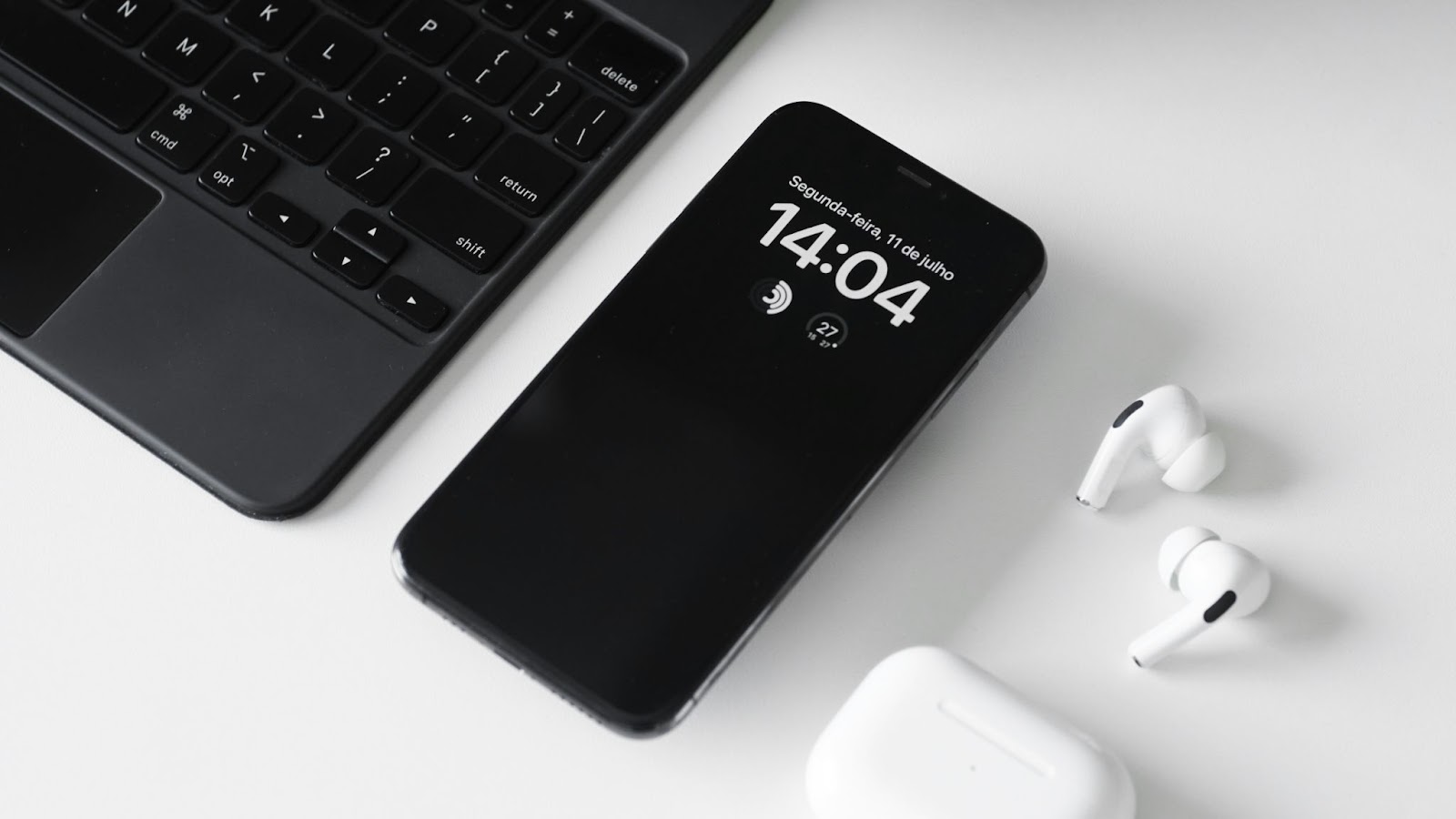 mobile phone next to computer