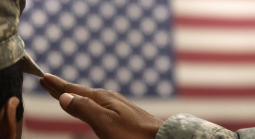 US soldier saluting the flag