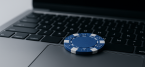 Laptop with casino chip